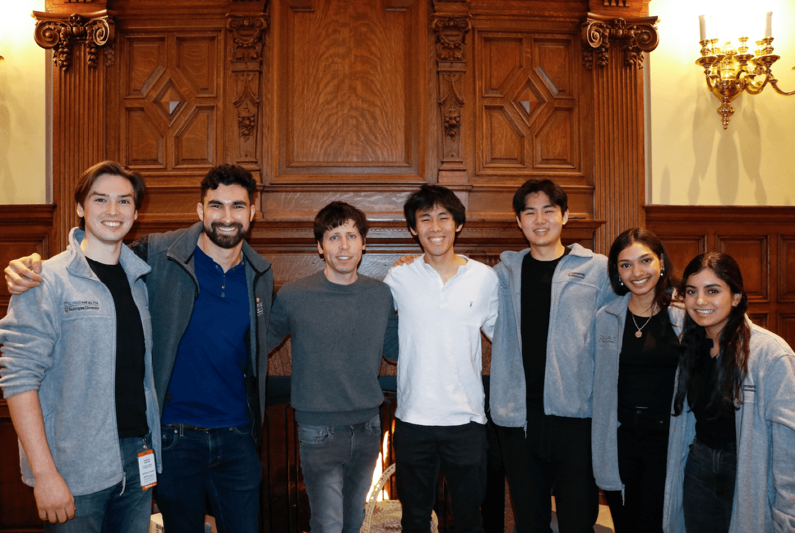 Sam Altman standing with a group of Sling Health students at the 2022 Speaker Series.